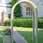 The Contemporary Garden Arch is a substantial and stylish structure. The chunky arched top, posts and slats are planed, rounded and chamfered for a modern look. Use with climbing plants along a pathway or as a standalone feature in your garden.