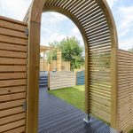 The Contemporary Garden Arch is a substantial and stylish structure. The chunky arched top, posts and slats are planed, rounded and chamfered for a modern look. Use with climbing plants along a pathway or as a standalone feature in your garden.