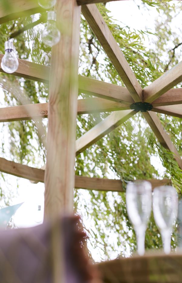 The Carousel Pergola is a timeless garden structure. The curves of the top beam reflect the natural shapes in your garden, whilst providing an effective frame for a garden feature beneath. The pressure-treated pale green timber protects from wood rot and decay