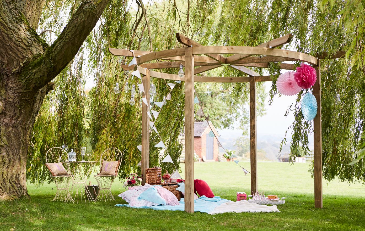 The Carousel Pergola is a timeless garden structure. The curves of the top beam reflect the natural shapes in your garden, whilst providing an effective frame for a garden feature beneath. The pressure-treated pale green timber protects from wood rot and decay