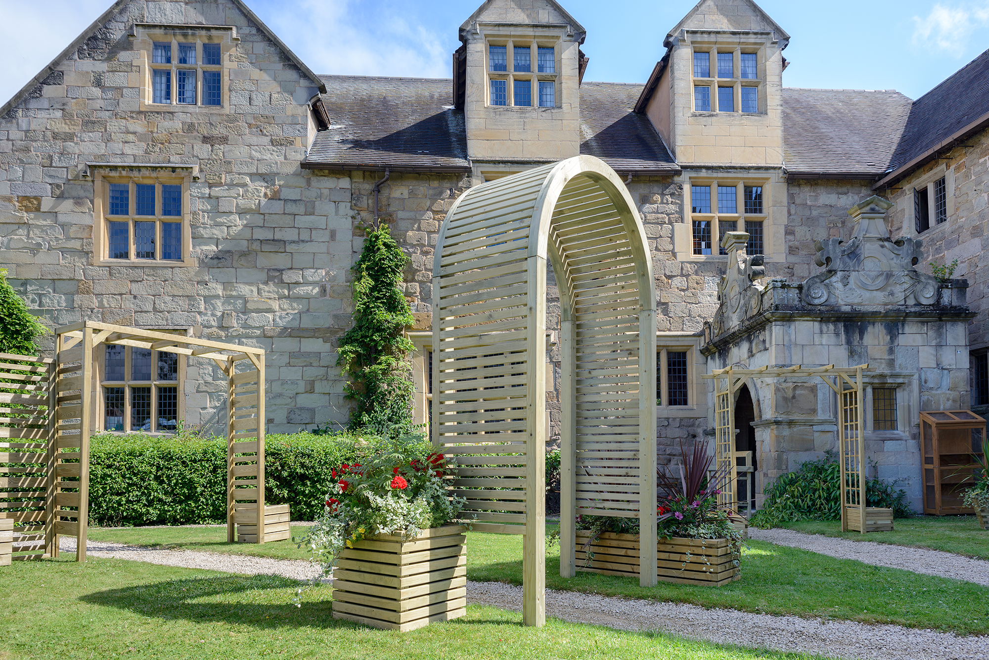The Contemporary Garden Arch is a substantial and stylish structure. The chunky arched top, posts and slats are planed, rounded and chamfered for a modern look. Use with climbing plants along a pathway or as a standalone feature in your garden.