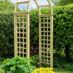 The Elite Granville Arch has a classical look as well as being strong and robust. This arch is suitable as a freestanding structure on either a path or garden space. The square trellis sides are ideal for climbing plants. Made from pressure treated timber and finished in pale green for longevity in use.