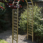 This subtle Elite Garden Arch creates an attractive garden structure. The square trellis sides are complemented by a curved top. The pressure treated timber provides extra resistance to outdoor elements.