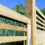 Featuring straight cut slats and a horizontal-style trellis top, the Elite Lille panel from Grange Fencing has been pressure-treated for long-lasting use. 