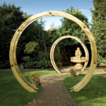 The contemporary Flower Circle is constructed using two pressure-treated timber rounded beams closely connected with stainless steel rods to create a sculptural archway. This versatile product can be used singularly or with multiples to create a unique pathway.