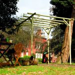 This Rustic Rose Pergola is made from machine rounded pressure-treated timber, creating a truly natural garden structure. An ideal pergola for a traditional setting and adding character to any outdoor space.