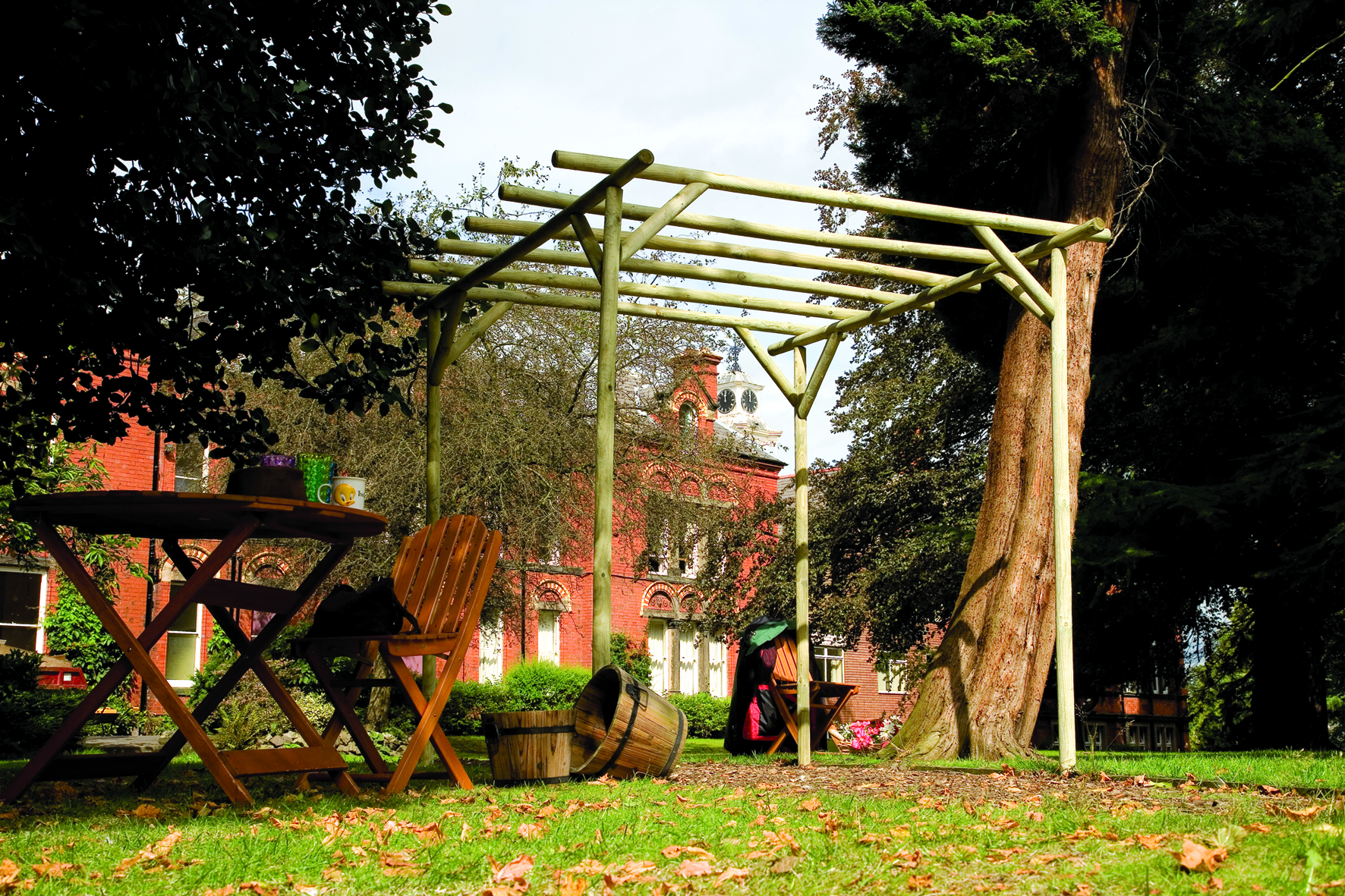 This Rustic Rose Pergola is made from machine rounded pressure-treated timber, creating a truly natural garden structure. An ideal pergola for a traditional setting and adding character to any outdoor space.