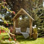 This classic arbour is designed with diamond trellis sides and back to support climbing plants. The slatted roof provides extra protection from the sun, and the sturdy yet comfortable bench enables you to sit back and relax. It is made from pressure-treated timber for long lasting protection.