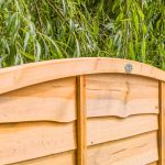 SUPERIOR BOW TOP LAP FENCE PANEL An added twist to a simple design, a stronger lap panel constructed using double waney edge slats that are secured into a neat arched shaped rebated frame.